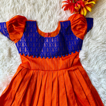 Majestic Waves: Orange Frock with Golden zari border