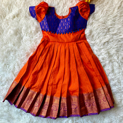 Majestic Waves: Orange Frock with Golden zari border