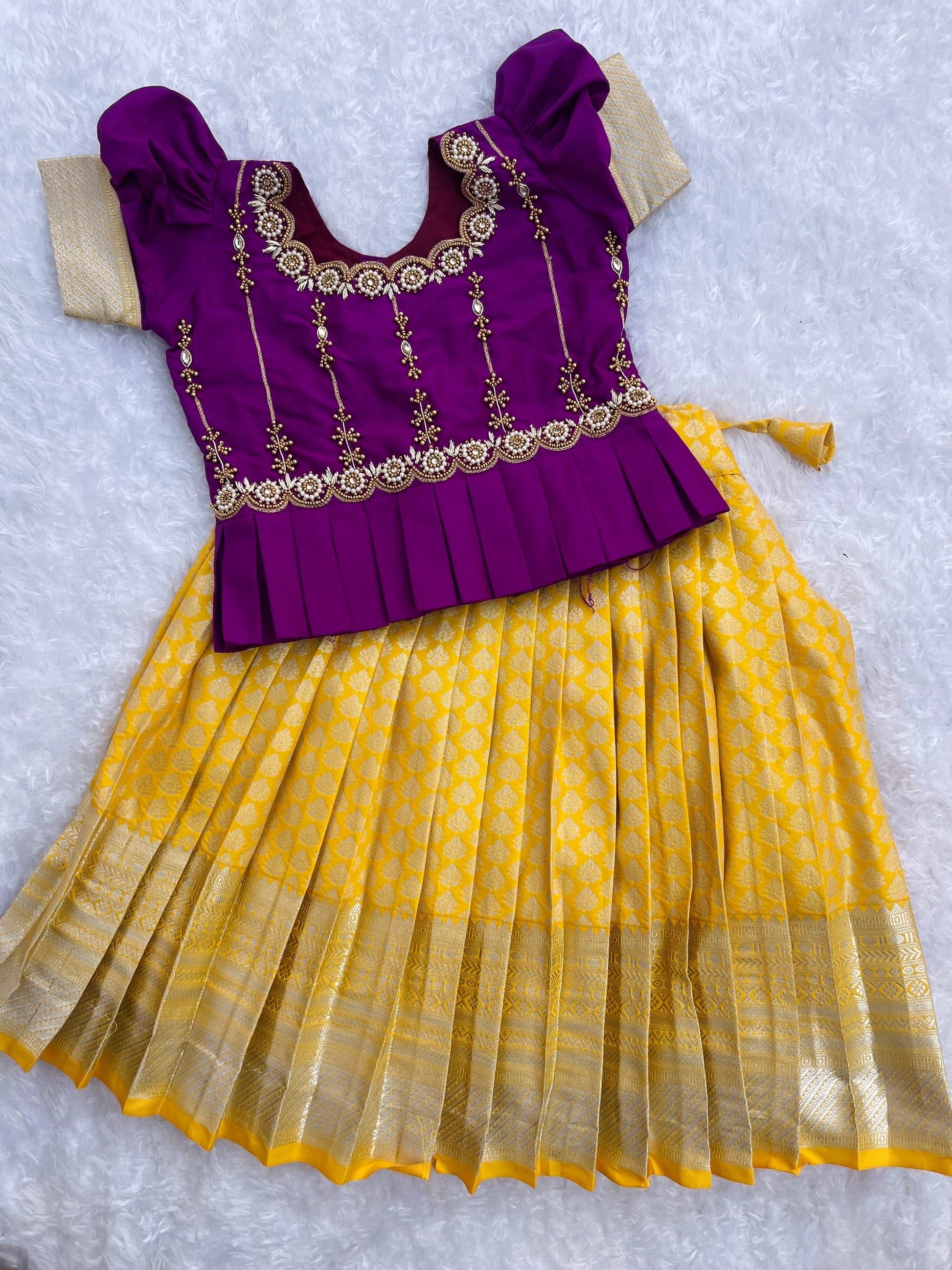 purple and yellow combination dress Lemon yellow and purple combination is bright vibrant and screams let's party. Very trendy to wear and comfortable to dance, or do ghaghra The high low top makes it different and will
